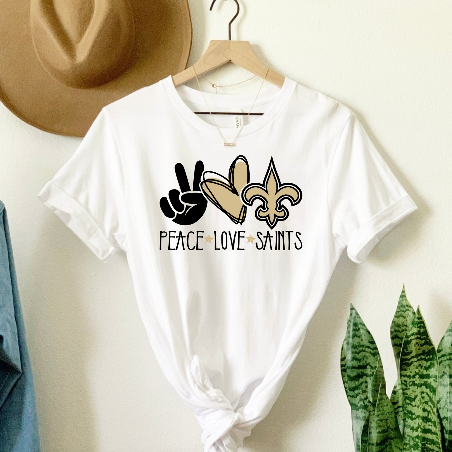 Celebrate the Saints with "PEACE, LOVE, SAINTS" Tee